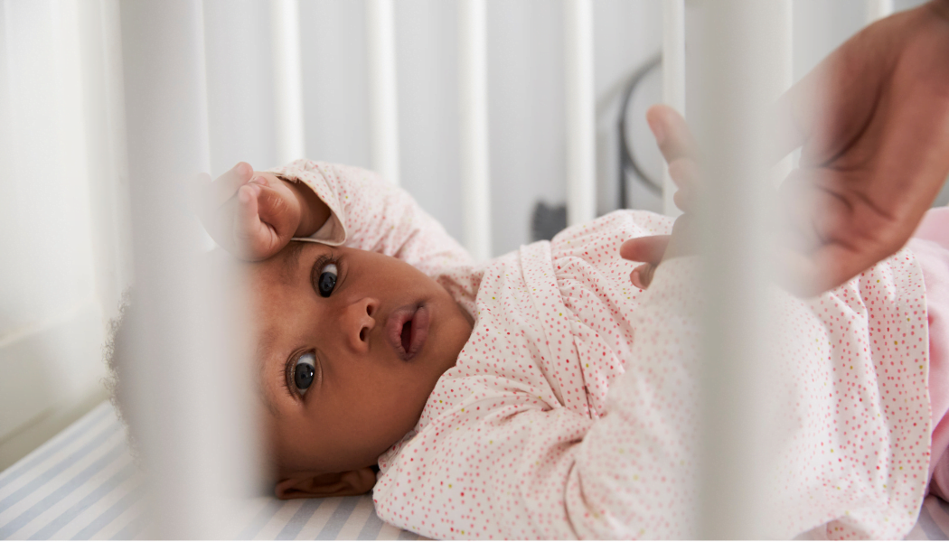 Baby awake in cot. 6 month sleep regression